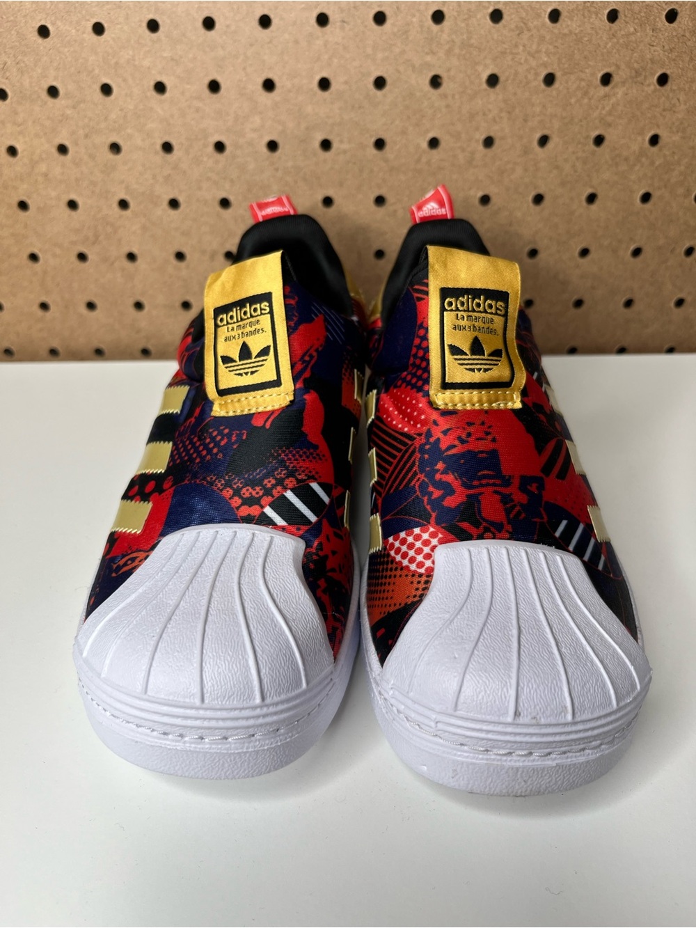 adidas Kids Slip-On Sneakers in Red, Black & Gold Accents
